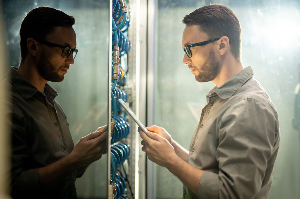 man working in server room